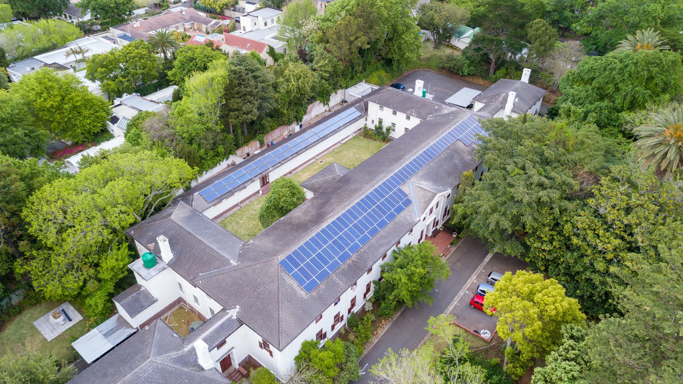 Solar panels installed on a large building roof