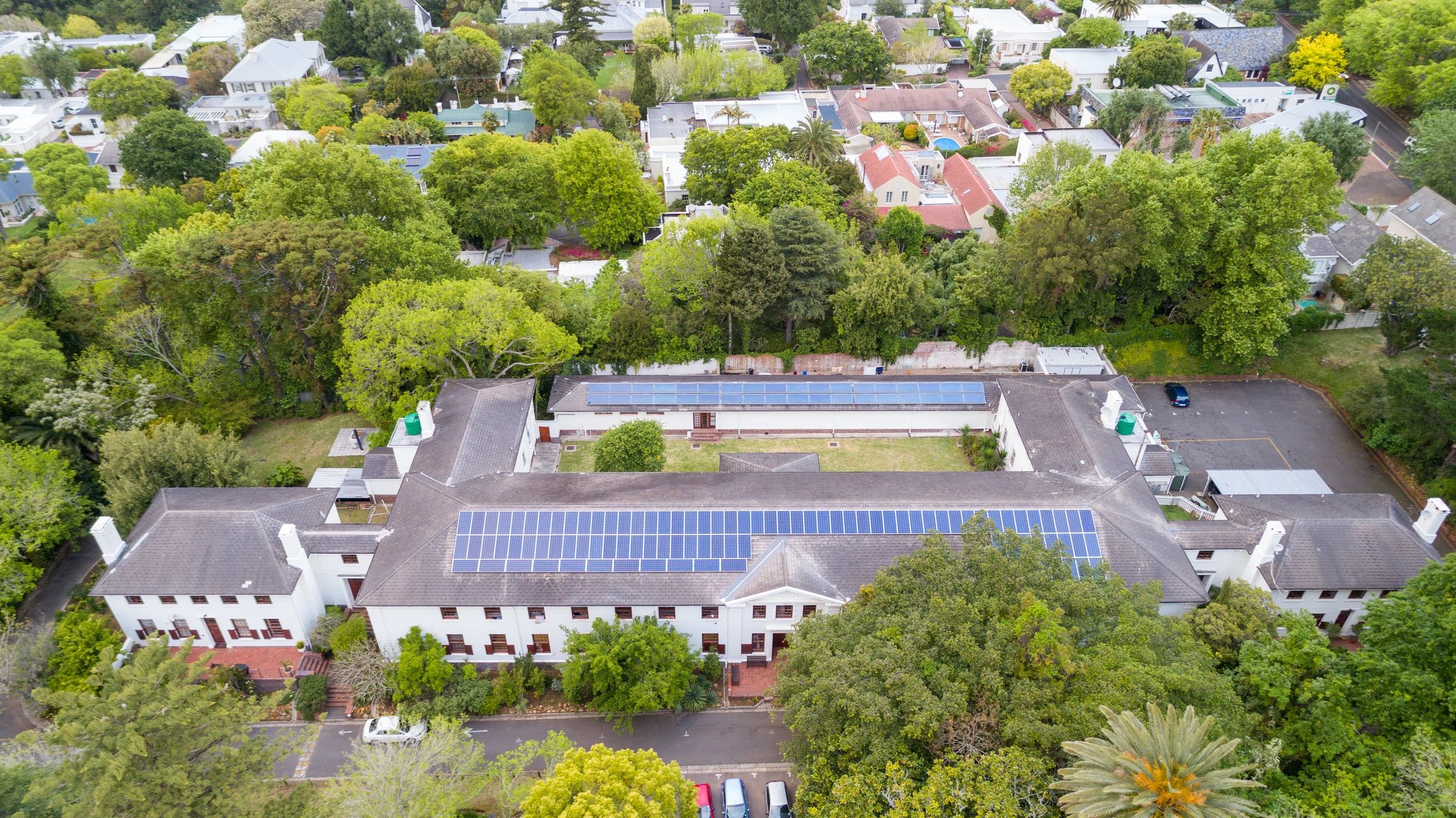 Building with rooftop solar panels representing energy efficiency