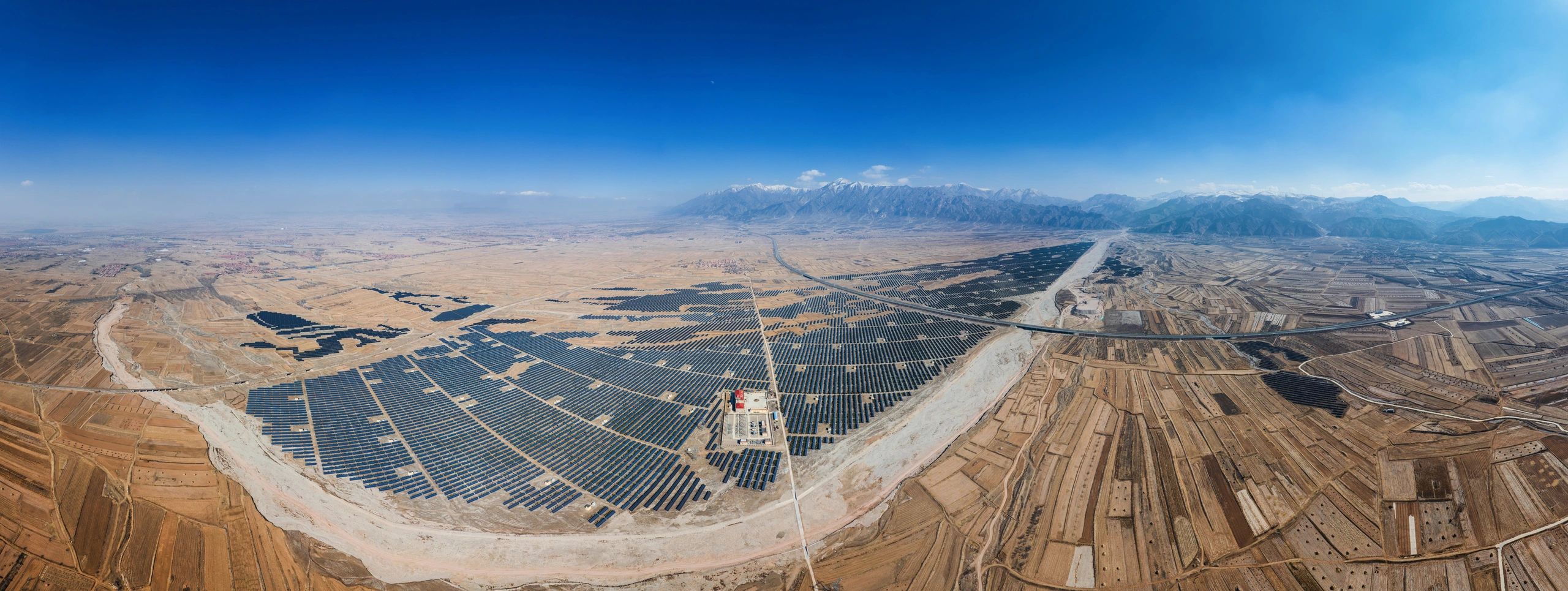 Aerial view of a solar energy facility representing renewable energy development